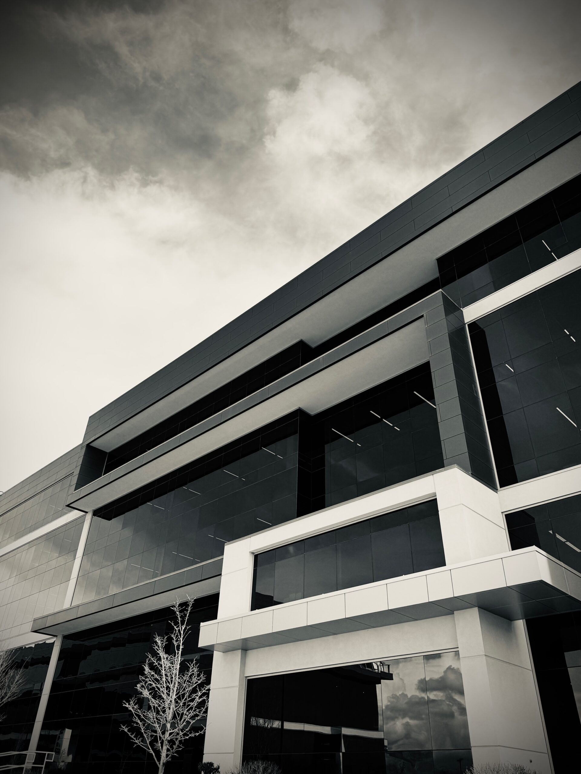 Black-and-white exterior photograph of the JTB Law office building in Lehi, Utah